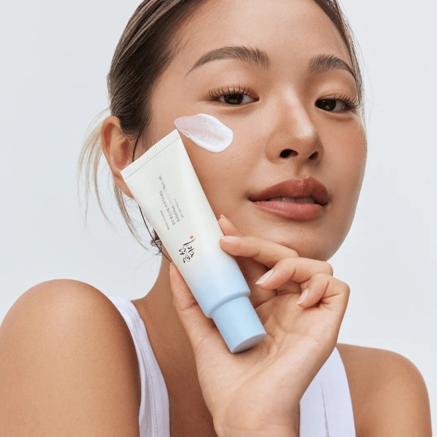 Beauty of Joseon Aqua Fresh Sun Rice+Panthenol Serum held by model