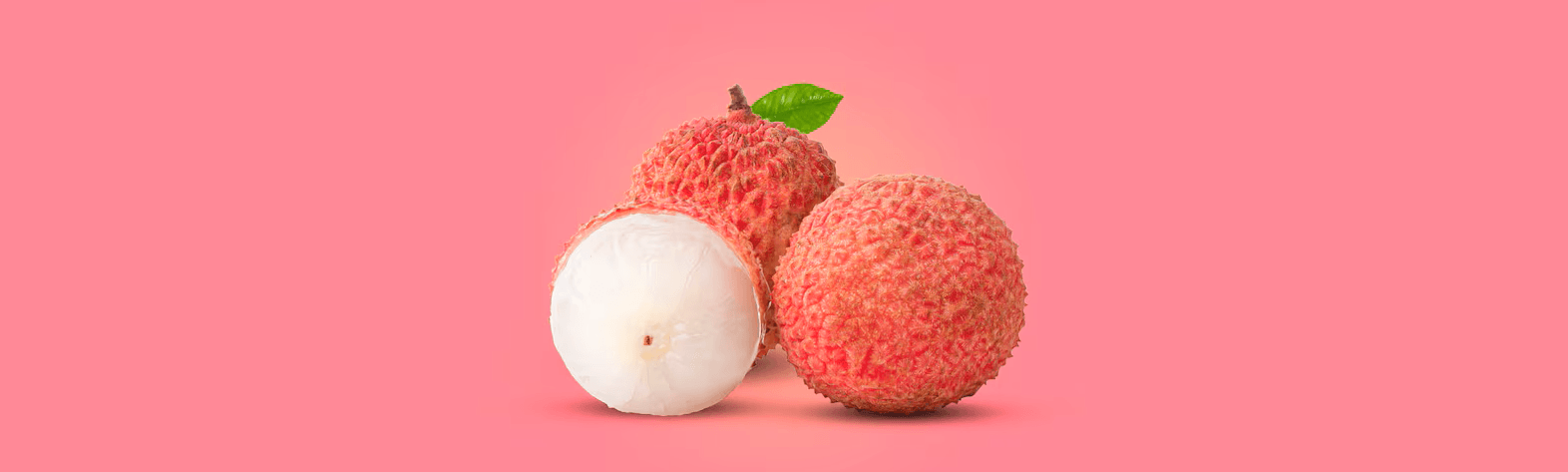 Lychee trio sitting in bright pink background