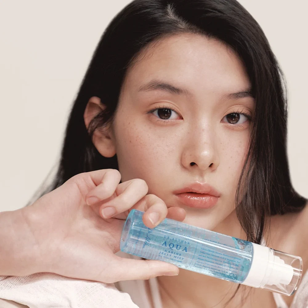 Dr Althea Aqua Marine Jelly Mist held by glowing model